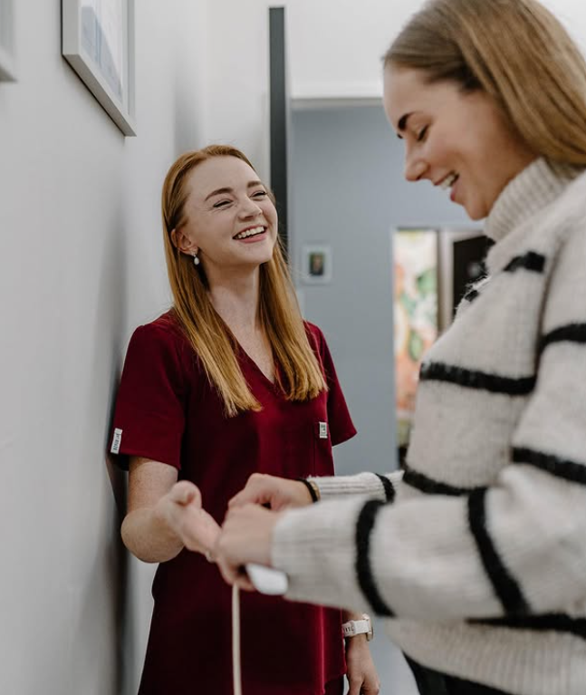 Dr Du Toit assisting client in consultaton